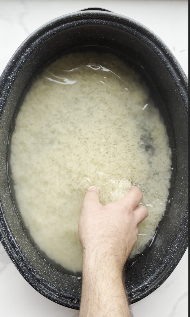 picture of basmati rice being soaked in a large pot